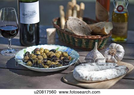 Wine, olives, sausage and traditionally french foods for picnic View Large Photo Image Stock Image - Wine, olives, sausage and traditionally french foods for picnic. Fotosearch