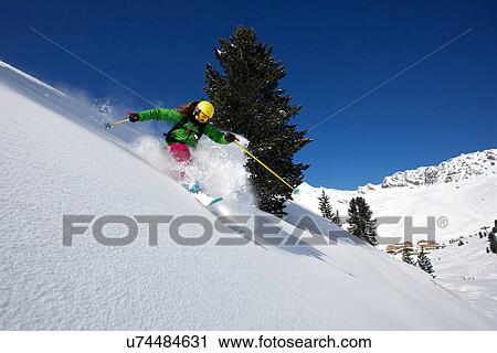 Stock Image - Woman off piste skiing in Kuhtai, Tirol, Austria. Fotosearch