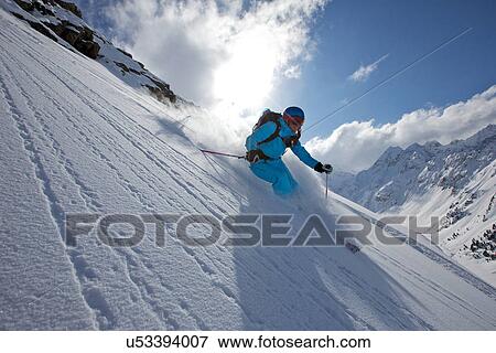 Stock Photo - Woman off piste skiing in Kuhtai, Tirol, Austria. Fotosearch