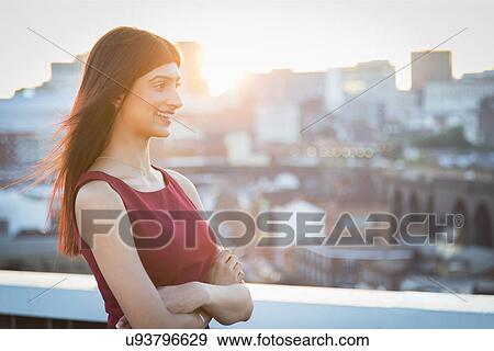 Woman on rooftop, Birmingham, England, UK View Large Photo Image Stock Photo - Woman on rooftop, Birmingham, England, UK. Fotosearch