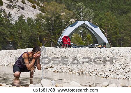 Woman washing face in river, Canyon du Verdon, Provence, France View Large Photo Image Stock Photo - Woman washing face in river, Canyon du Verdon, Provence, France. Fotosearch