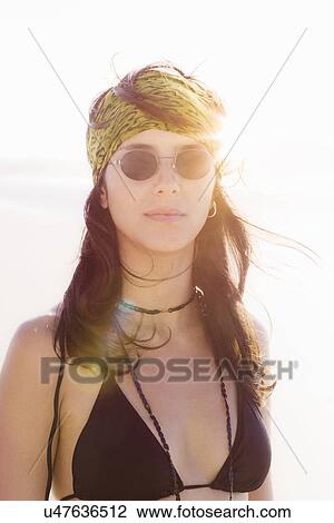 Woman wearing bikini top and sunglasses View Large Photo Image Stock Image - Woman wearing bikini top and sunglasses. Fotosearch