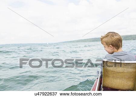 Young boy on pedalo, Lake Ammersee, Bavaria, Germany View Large Photo Image Stock Photo - Young boy on pedalo, Lake Ammersee, Bavaria, Germany. Fotosearch