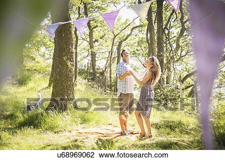 Young couple dancing in forest View Large Photo Image Stock Image - Young couple dancing in forest. Fotosearch