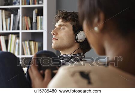 Young couple relaxing View Large Photo Image Stock Image - Young couple relaxing. Fotosearch