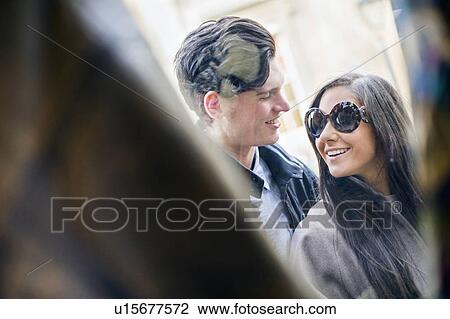 Stock Image - Young couple window shopping. Fotosearch