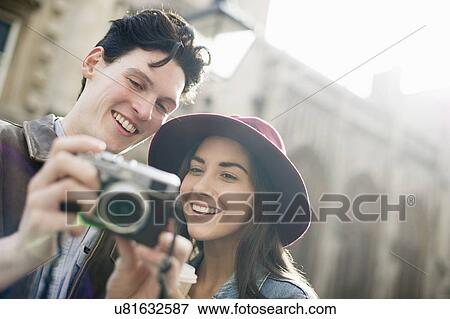Young couple with vintage camera View Large Photo Image Stock Photo - Young couple with vintage camera. Fotosearch