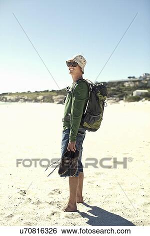Young man on beach, Cape Town, South Africa View Large Photo Image Stock Photograph - Young man on beach, Cape Town, South Africa. Fotosearch
