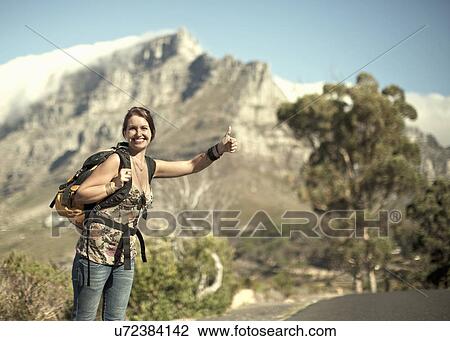 Young woman hitchhiking from Table Mountain, Cape Town, South Africa View Large Photo Image Stock Image - Young woman hitchhiking from Table Mountain, Cape Town, South Africa. Fotosearch