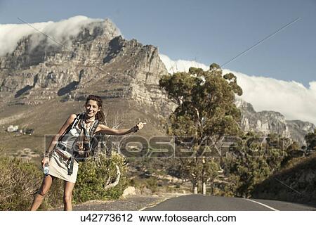 Young woman hitching from Table Mountain, Cape Town, South Africa View Large Photo Image Stock Image - Young woman hitching from Table Mountain, Cape Town, South Africa. Fotosearch