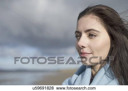Young woman looking at view View Large Photo Image Stock Photo - Young woman looking at view. Fotosearch