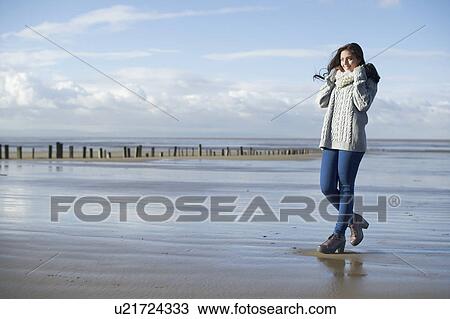 Young woman on beach, Brean Sands, Somerset, England View Large Photo Image Stock Image - Young woman on beach, Brean Sands, Somerset, England. Fotosearch