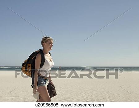 Stock Photography - Young woman on beach, Cape Town, South Africa. Fotosearch
