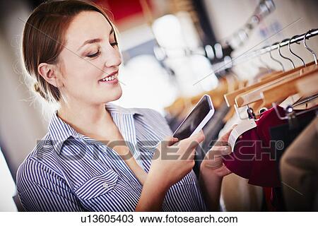 Young woman scanning barcode with smartphone View Large Photo Image Stock Image - Young woman scanning barcode with smartphone. Fotosearch