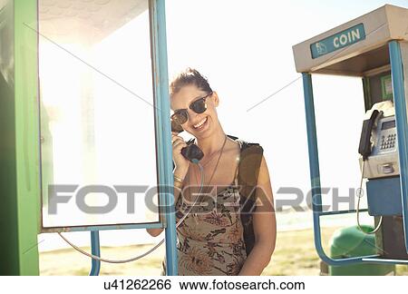 Young woman using phone booth, Cape Town, South Africa View Large Photo Image Stock Photograph - Young woman using phone booth, Cape Town, South Africa. Fotosearch