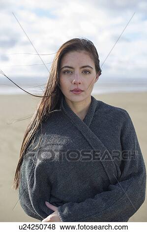 Stock Photo - Young woman wearing grey jacket. Fotosearch