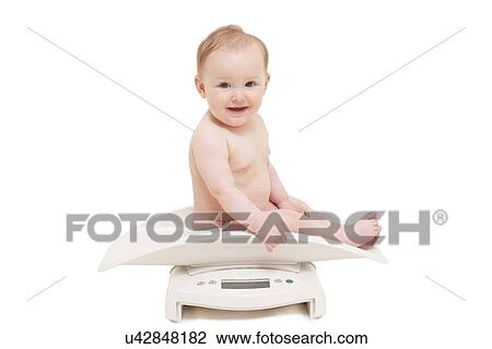 Baby being weighed View Large Photo Image Stock Image - Baby being weighed. Fotosearch