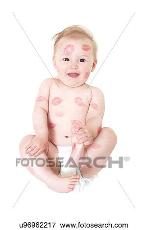 Stock Photo - Baby covered in kisses. Fotosearch