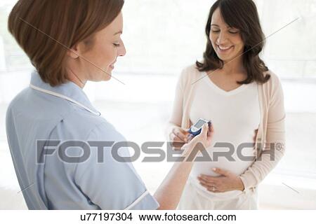 Blood glucose test in pregnancy View Large Photo Image Picture - Blood glucose test in pregnancy. Fotosearch