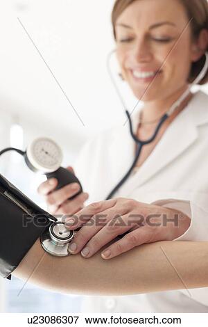 Blood pressure measurement View Large Photo Image Stock Photo - Blood pressure measurement. Fotosearch