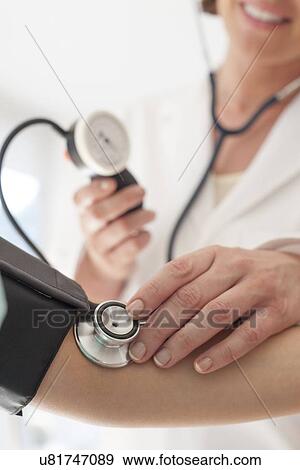 Stock Photo - Blood pressure measurement. Fotosearch