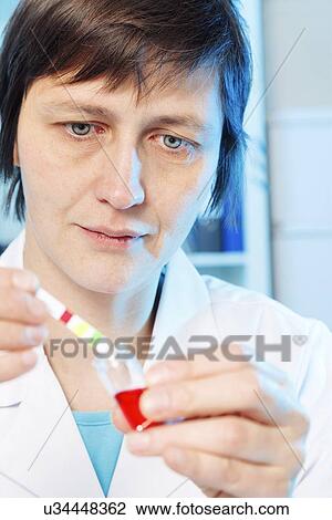 Stock Image - Chemistry experiment. Fotosearch
