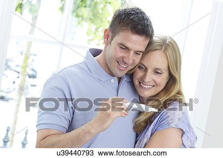 Stock Image - Couple with pregnancy test. Fotosearch