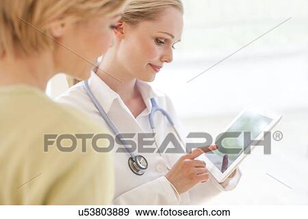 Stock Photo - Doctor using a tablet computer. Fotosearch
