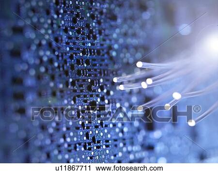 Stock Image - Fibre optics and circuit board. Fotosearch