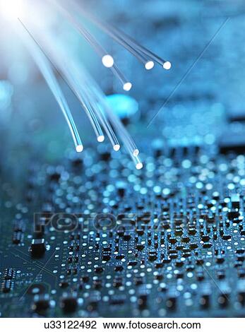 Stock Image - Fibre optics and circuit board. Fotosearch