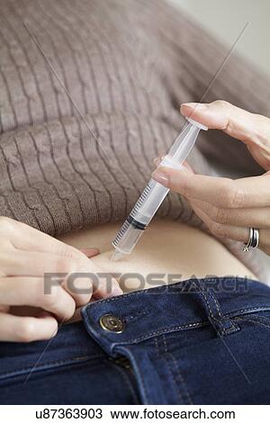 Stock Image - Hormone injection for IVF. Fotosearch