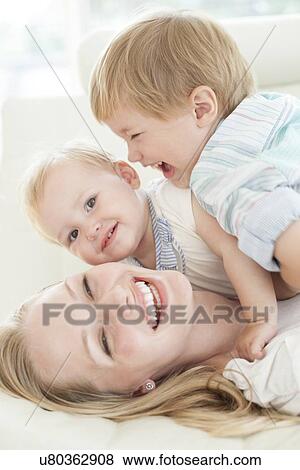 Stock Photo - Mother and children. Fotosearch