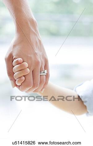 Mother and son holding hands View Large Photo Image Stock Photograph - Mother and son holding hands. Fotosearch
