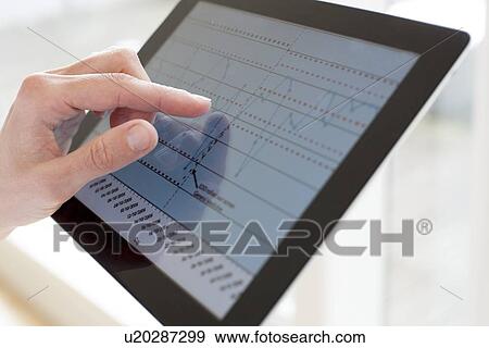 Nurse using a tablet computer View Large Photo Image Stock Photo - Nurse using a tablet computer. Fotosearch
