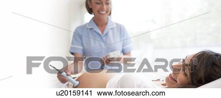 Stock Image - Obstetric examination. Fotosearch