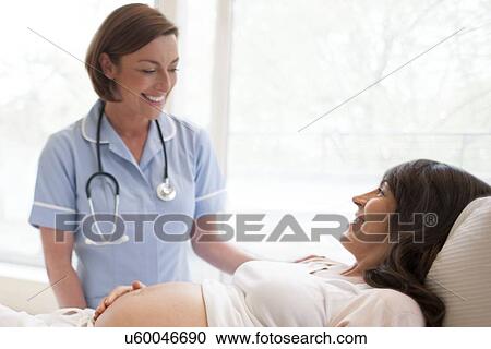Stock Image - Obstetric examination. Fotosearch