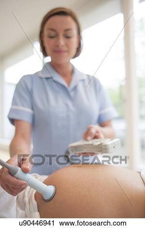 Stock Image - Obstetric examination. Fotosearch