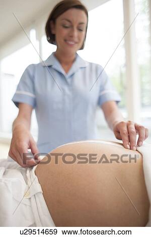 Stock Photo - Obstetric examination. Fotosearch