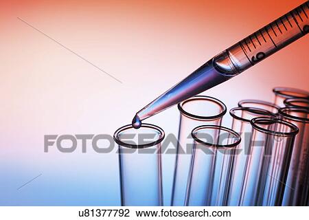 Stock Image - Pipetting liquid. Fotosearch
