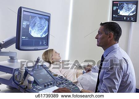 Stock Photo - Pregnancy ultrasound scan. Fotosearch
