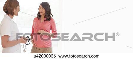Stock Photography - Pregnant woman and nurse. Fotosearch