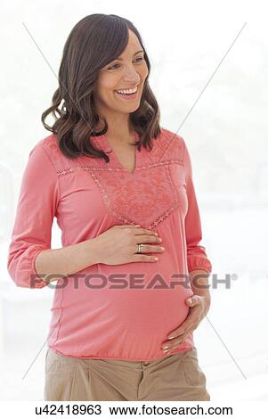 Stock Image - Pregnant woman. Fotosearch
