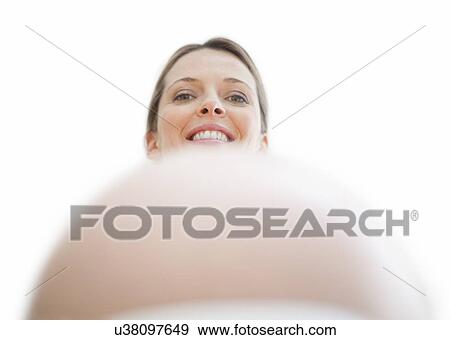 Stock Photo - Pregnant woman's abdomen. Fotosearch