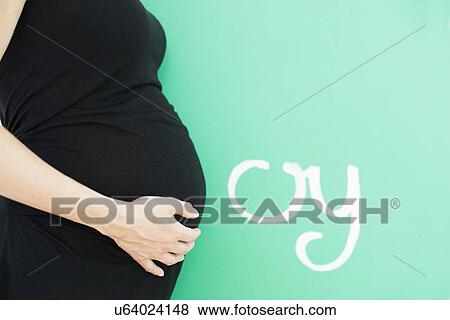 Pregnant woman's abdomen View Large Photo Image Stock Photo - Pregnant woman's abdomen. Fotosearch