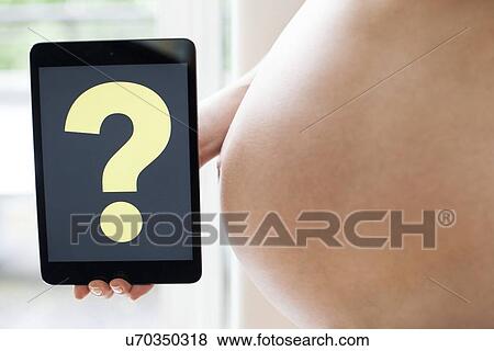Pregnant woman's abdomen View Large Photo Image Stock Photo - Pregnant woman's abdomen. Fotosearch
