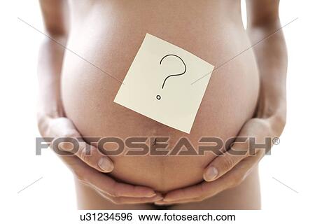 Stock Photograph - Pregnant woman's abdomen. Fotosearch