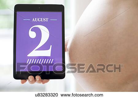 Stock Image - Pregnant woman's due date. Fotosearch