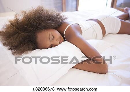 Stock Photo - Teenage girl sleeping. Fotosearch