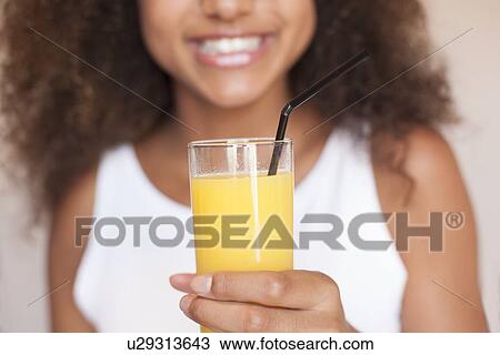 Teenage girl with fruit juice View Large Photo Image Stock Image - Teenage girl with fruit juice. Fotosearch