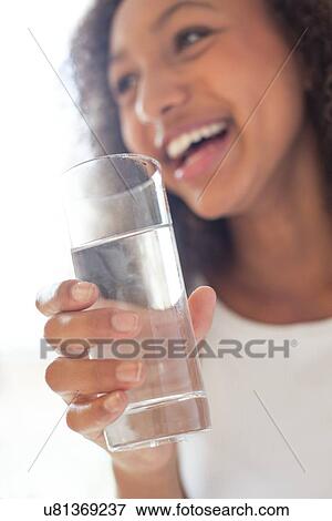 Stock Photo - Teenage girl with glass of water. Fotosearch